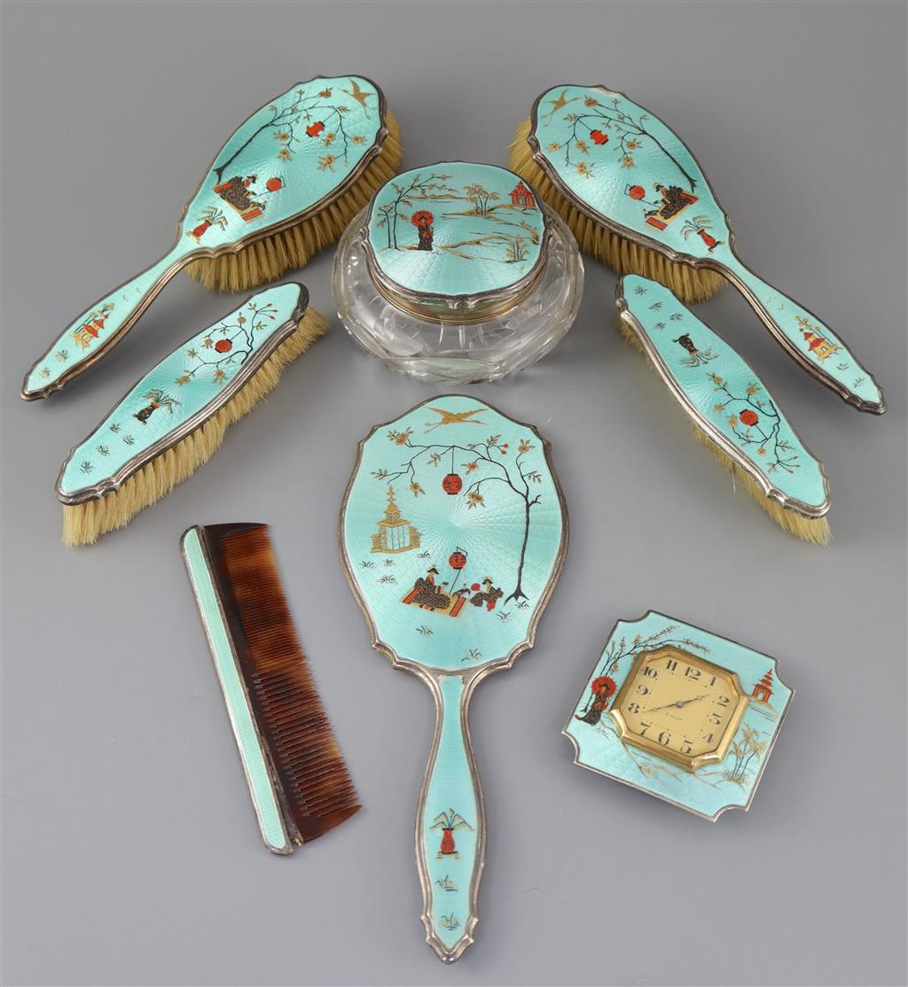 A 1920s silver and gilded chinoiserie guilloche enamel eight piece dressing table set, by Adie Bros,